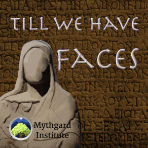 An eerily faceless sculpture with a veil sits on the left of the image before a background of carven letters on stone. The words on the right read "Till We Have Faces"